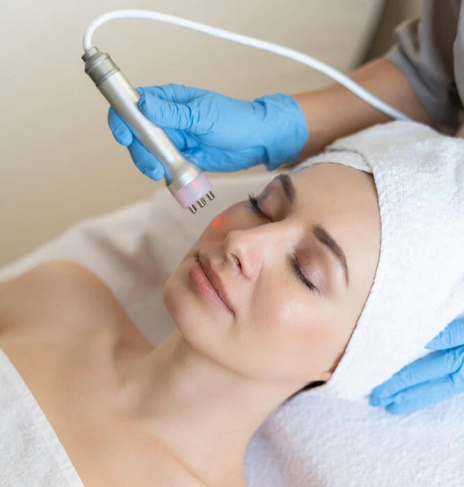 A woman is receiving a Laser Vascular Pigmented Lesion Treatment.